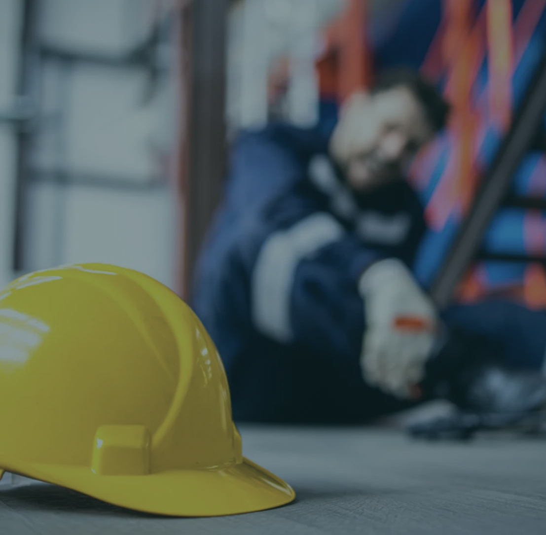 worker holds injured leg